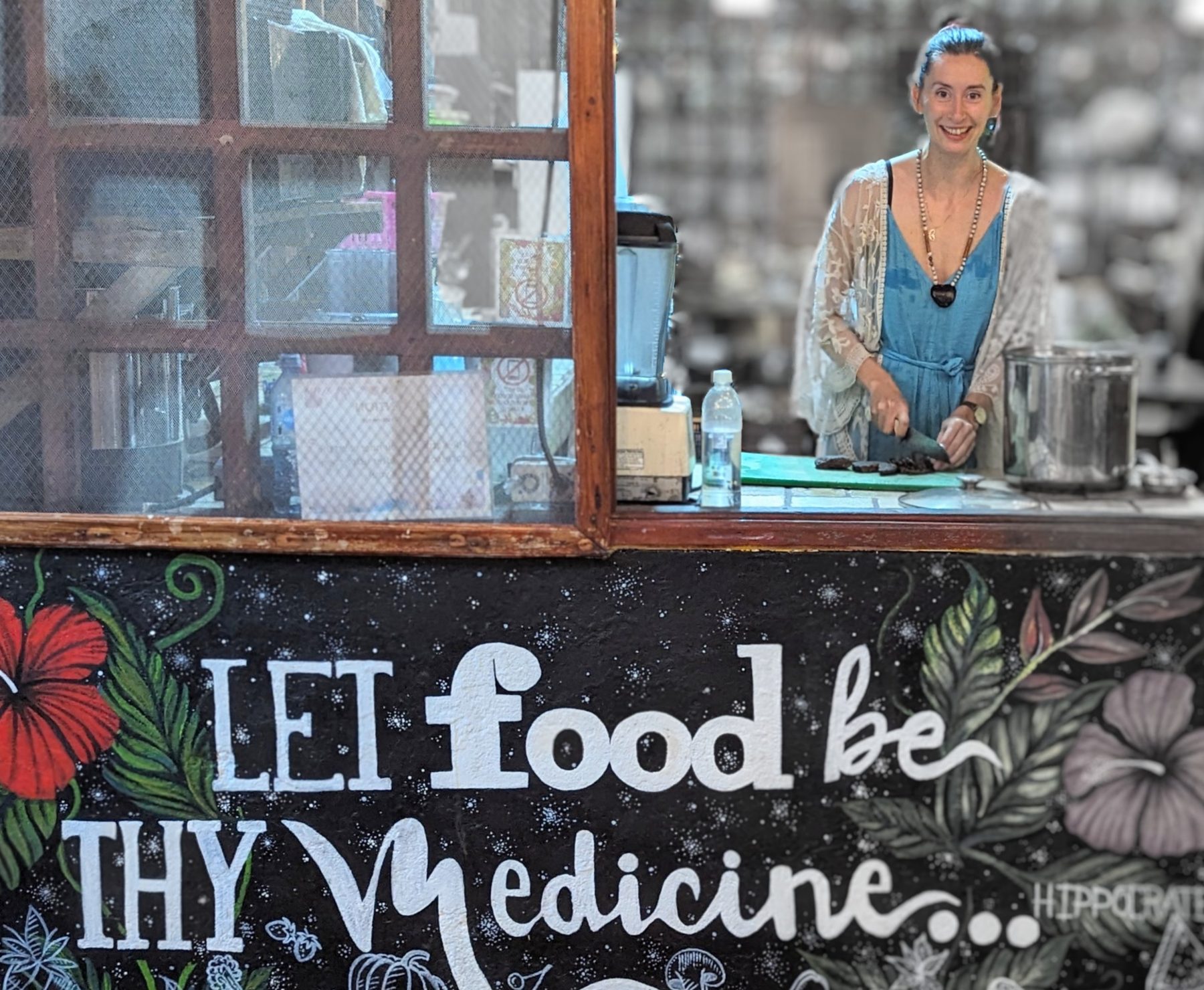 The retreat kitchen, with a hand-painted sign reading Let food be thy medicine