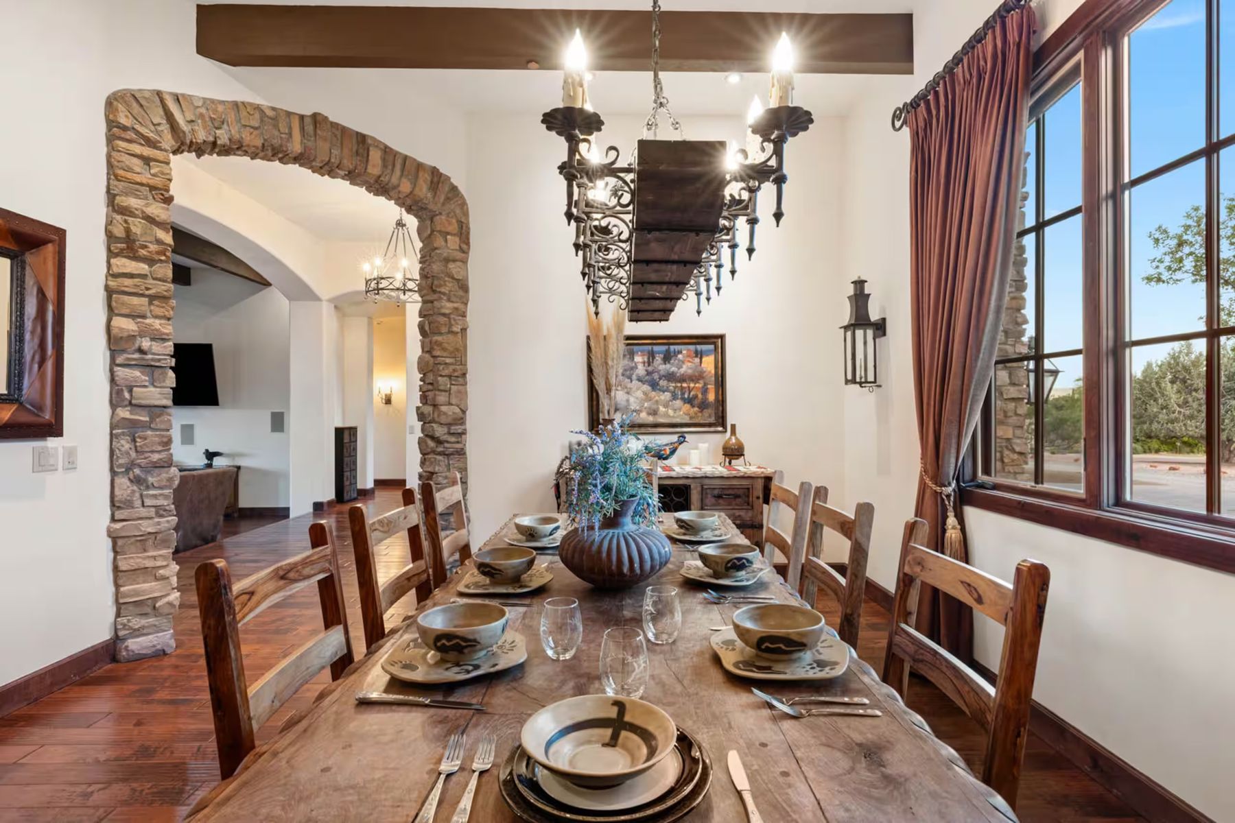Long wooden dining table set for a shared meal