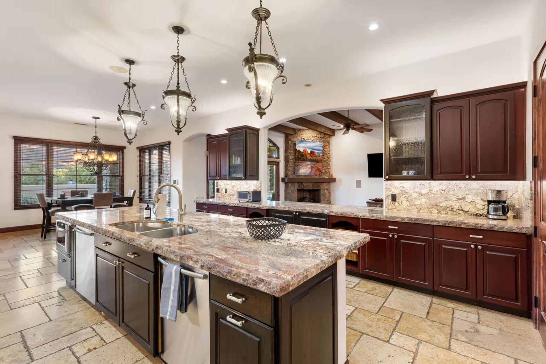 Large kitchen with a granite island and wood cabinets