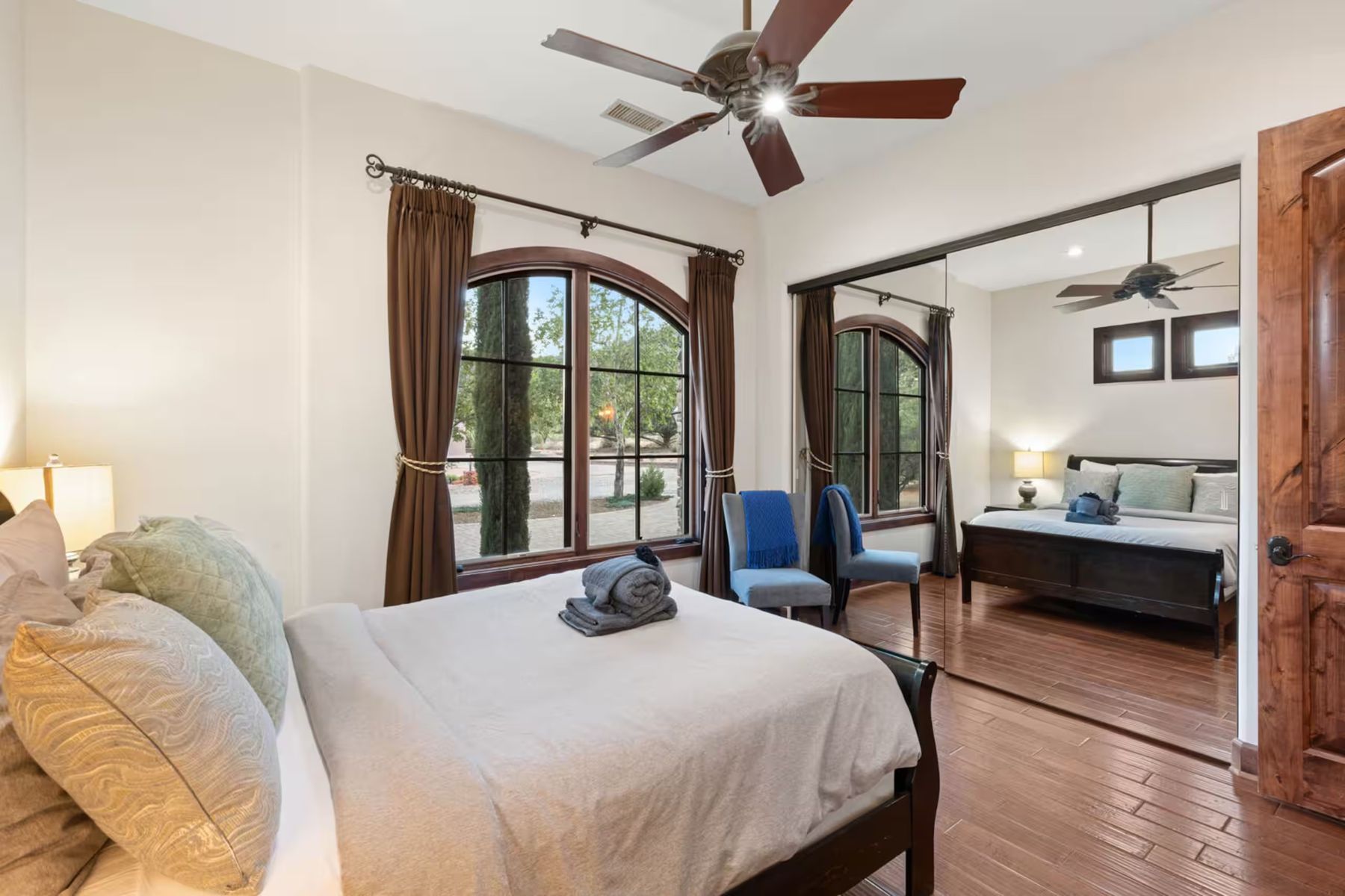 Queen bedroom with arched windows